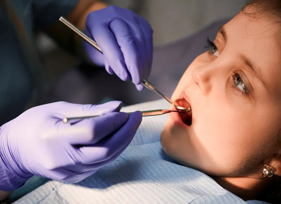 Child smiling in the dental chair