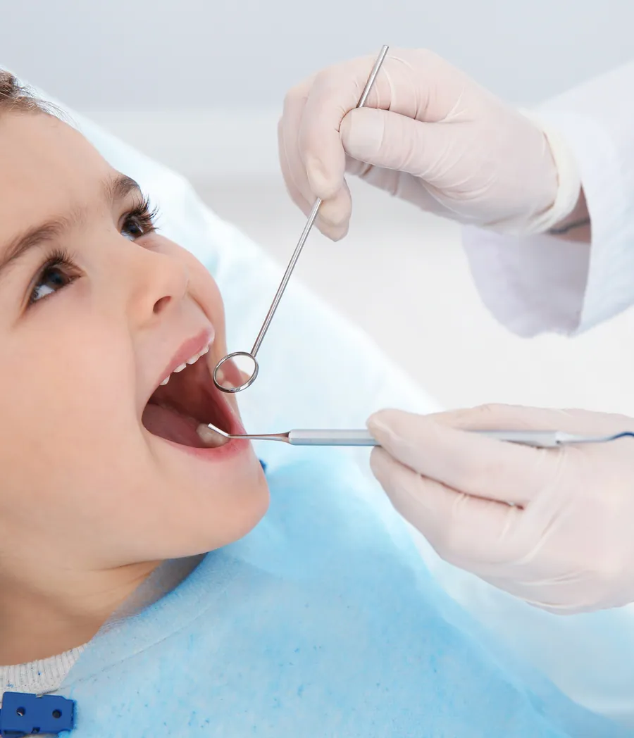 Dentist treating a child's tooth