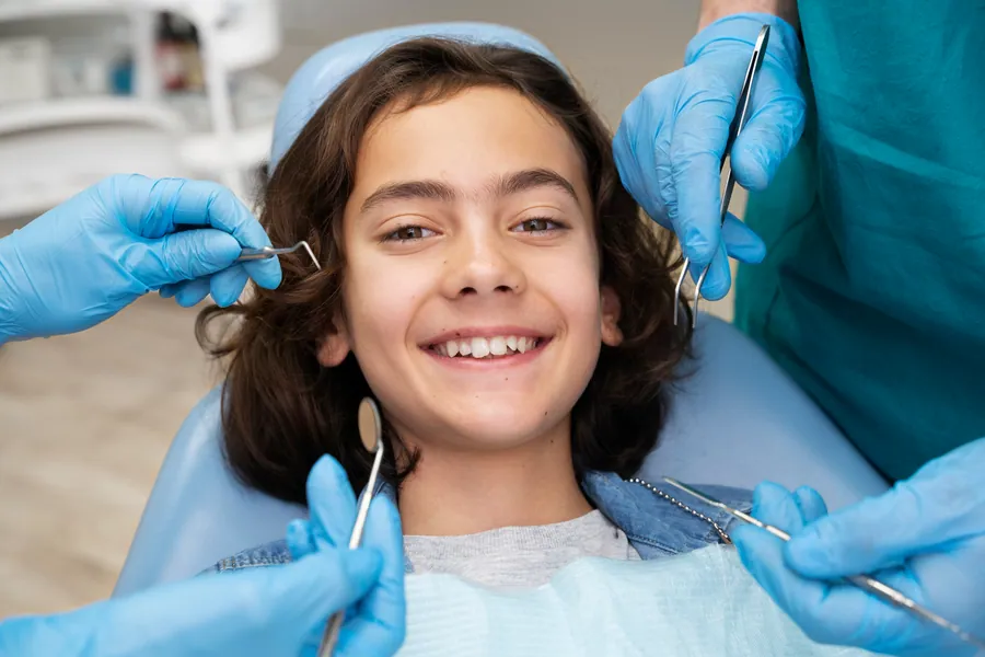 Sealant being applied to a child's molar