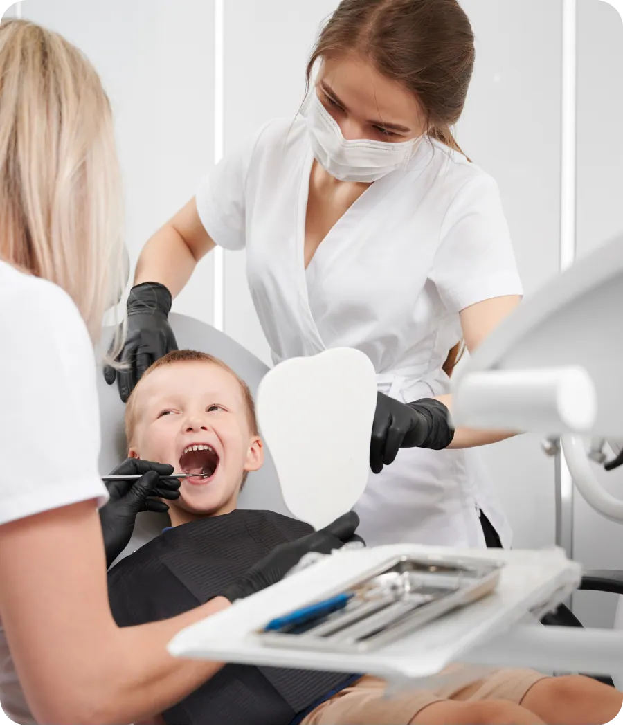 Pediatric dentist with a young patient