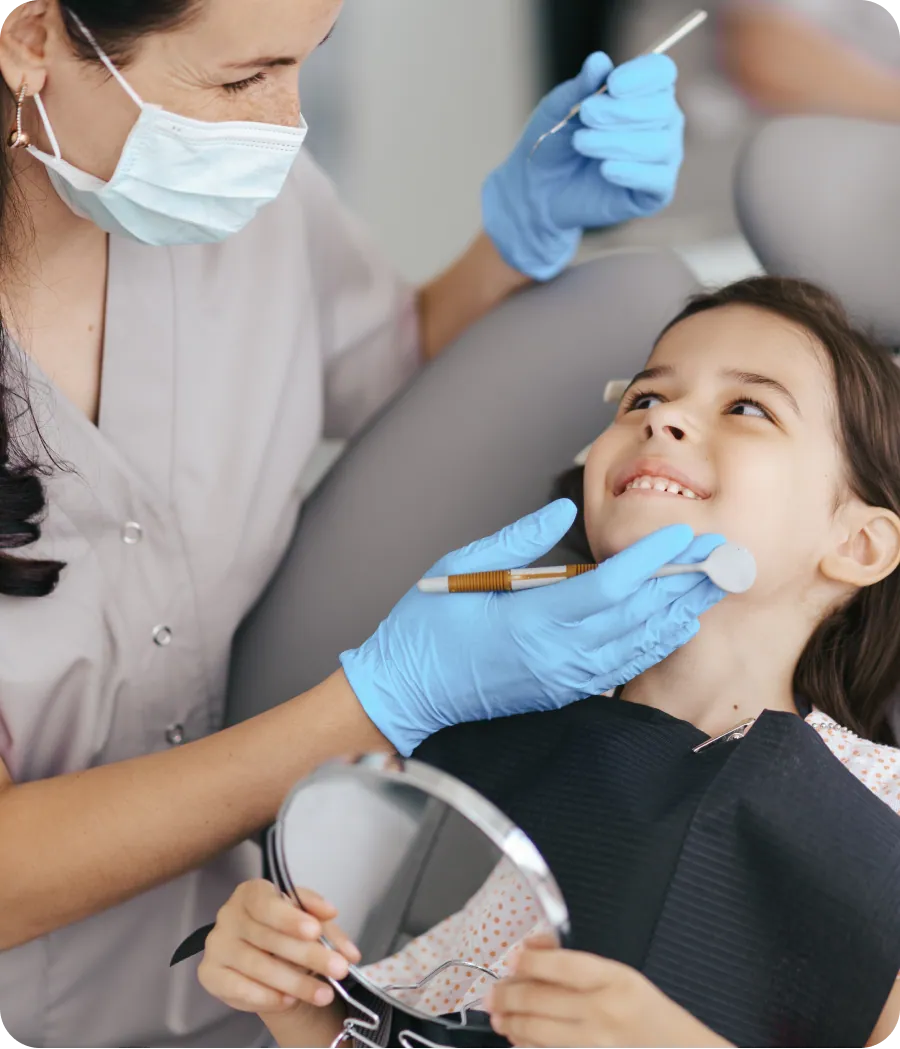 Child smiling in the dental chair